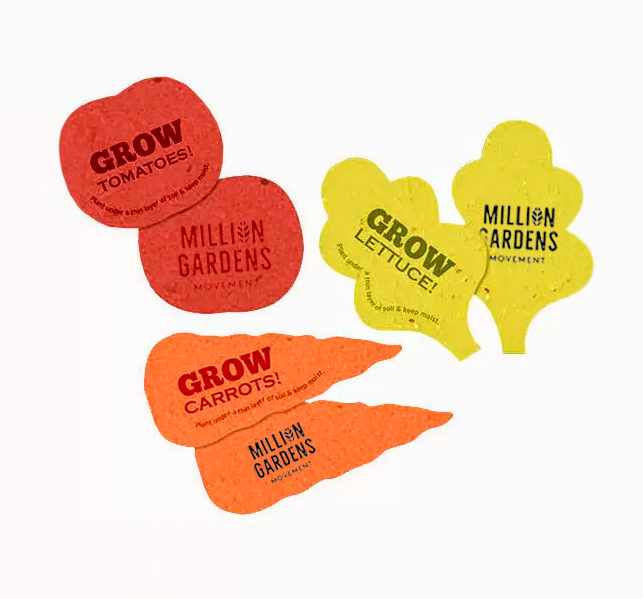 A tomato shaped, lettuce shaped and carrot shaped set of seed paper that say GROW
