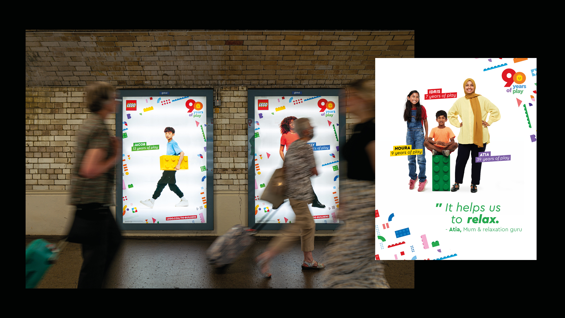 photo of lego posters from 90 years of play campaign on tube wall